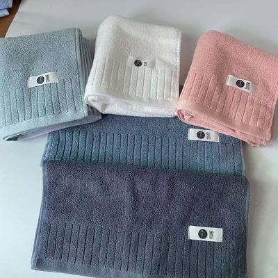Soft and plush cotton bath towel with double-sided extreme strand plain striped design