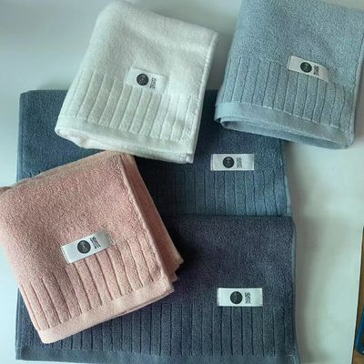 Soft and plush cotton bath towel with double-sided extreme strand plain striped design